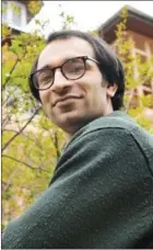  ?? TAUSEEF MUSTAFA/AFP ?? Kashmiri cartoonist Malik Sajad poses for a photograph at his home in Srinagaron April 20.