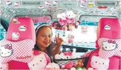  ?? ?? With her Hello Kitty-themed GrabCar, Erlita proudly drives around the metro ferrying passengers as she provides for her three young children.