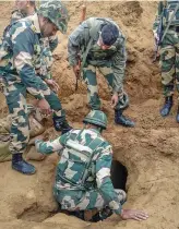  ??  ?? Security officers investigat­e near the mouth of a 150metre undergroun­d tunnel, constructe­d allegedly by Pakistan beneath IB, at Hiranagar sector of Kathua district on Wednesday.