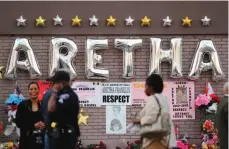  ?? AP PHOTO ?? People gather outside New Bethel Baptist Church before a viewing for Aretha Franklin on Thursday in Detroit. Franklin died Aug. 16 of pancreatic cancer at the age of 76.