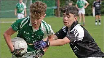  ??  ?? Ross Walker of Crossabeg-Ballymurn forces his way past Lee Byrne (St. Joseph’s).