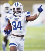  ?? Vasha Hunt / Associated Press ?? Georgia State defensive back Antavious Lane runs back an intercepti­on for a touchdown against Ball State during the second half of the Camellia Bowl NCAA game on Saturday in Montgomery, Ala.