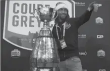  ?? ADRIAN WYLD, THE CANADIAN PRESS ?? Stampeders defensive back Shaquille Richardson poses with the prize during the CFL Grey Cup Media Day in Ottawa on Thursday.