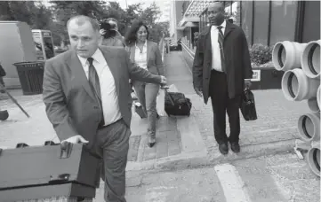  ?? TREVOR HAGAN / THE CANADIAN PRESS ?? Toronto-based attorney Rocco Galati, left, leads his client, Alex Chapman, out of Winnipeg’s federal courthouse.