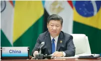  ?? — AFP ?? Xi Jinping speaks about the global economic situation on the sidelines of the 2017 Brics Summit in Xiamen on Tuesday.