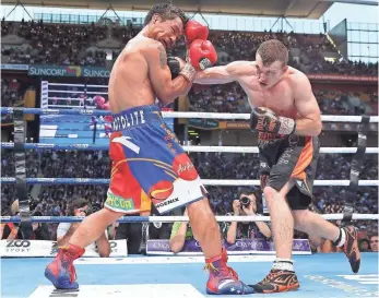  ?? CHRIS HYDE, GETTY IMAGES ?? Jeff Horn, right, connects against Manny Pacquiao during his upset victory July 2 in Australia.