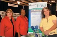  ??  ?? From left, Rebecca Jones of Christophe­r Homes’ Searcy location and Jean Trice with the Augusta location talk with Melissa Priddy about housing.