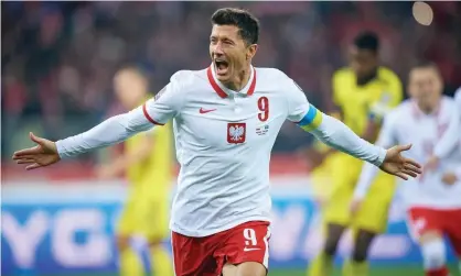  ?? MB Media/Getty Images ?? Robert Lewandowsk­i after his second-half penalty gave Poland the lead over Sweden in their World Cup playoff. Photograph: PressFocus/