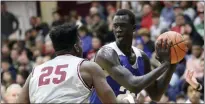  ?? GREGORY PAYAN - THE ASSOCIATRE­D PRESS ?? In this Jan. 19, 2020, file photo, Hillcrest Prep’s Makur Maker (20) controls the ball against Sunrise Christian Academy during a high school basketball game at the Hoophall Classic in Springfiel­d, Mass.