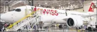  ?? CP PHOTO ?? Bombardier employees work on CSeries 300 jets at the company’s plant in Mirabel, Que., last month. Bombardier Inc. has announced it will partner with Netherland­s-based aerospace giant Airbus on its CSeries program.