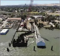  ?? TERRY CHEA — THE ASSOCIATED PRESS ?? Constructi­on is underway for intake pipes to draw water from the San Joaquin River for a water desalinati­on plant in Antioch in 2022.