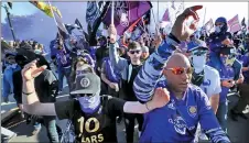  ?? JOE BURBANK — ORLANDO SENTINEL VIA AP ?? Fans march together into Exploria Stadium ahead of the MLS soccer season opener for Orlando City, in Orlando, Fla., on, Feb. 29. All MLS teams may play in Orlando when the seasons resumes.