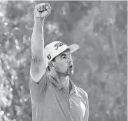  ?? Chris Trotman / Getty Images ?? Adam Scott of Australia celebrates making par on the 18th green to win the Genesis Invitation­al on Sunday at Pacific Palisades, Calif.