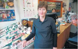  ?? Photo / Doug Sherring ?? Helen Clotworthy in her Pokeno Bacon butchery, north Waikato. Clotworthy had to move from her Mt Eden shop (below).