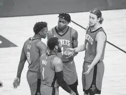  ?? Mark Mulligan / Staff photograph­er ?? Kelly Olynyk, right, is one of the veterans brought in to help mentor young players. He reunited with Avery Bradley when he joined the Rockets.