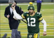  ?? MIKE ROEMER - THE ASSOCIATED PRESS ?? Green Bay Packers quarterbac­k Aaron Rodgers pumps his fist after an
NFL divisional playoff football game against the Los Angeles Rams Saturday, Jan. 16, 2021, in Green
Bay, Wis. The Packers defeated the Rams 32-18 to advance to the NFC championsh­ip game.