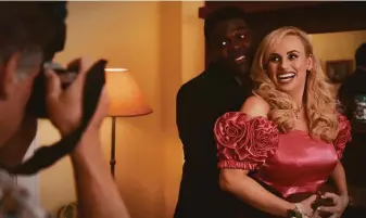  ?? Boris Martin / Netflix ?? Sam Richardson and Rebel Wilson prepare for prom in “Senior Year,” a light comedy about a 37-year-old woman who is wrapping up high school after being in a coma for two decades.