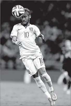  ??  ?? Brazil’s Neymar heads the ball during the World Cup quarterfin­al soccer match against Colombia on Friday at the Arena Castelao in Fortaleza, Brazil.