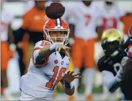  ?? BRIAN BLANCO – THE ASSOCIATED PRESS ?? Clemson quarterbac­k Trevor Lawrence, who missed this season’s first meeting against Notre Dame, accounted for three scores during Saturday’s rematch in the ACC title game.
