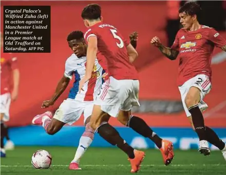  ?? AFP PIC ?? Crystal Palace’s Wilfried Zaha (left) in action against Manchester United in a Premier League match at Old Trafford on Saturday.