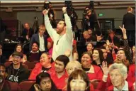  ??  ?? Supporters cheer as they watch the results come in for the general election between incumbent Prime Minister Jacinda Ardern and challenger Judith Collins during the New Zealand Labour Party election night event in Auckland.