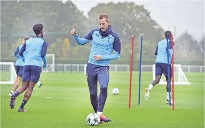  ??  ?? LONDON: Tottenham Hotspur’s English striker Harry Kane (C) attends a training session at Tottenham Hotspur’s Enfield Training Centre, northeast of London yesterday. Tottenham will play Bayer Leverkusen in a UEFA Champions League group stage match...