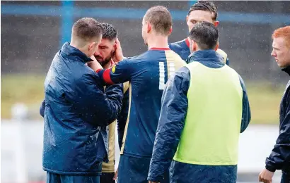  ?? Photograph: SNS ?? Paul Woods is consoled by East Kilbride team-mates following his penalty miss