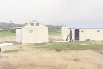  ??  ?? Isolation tents being set up at Aranka in the Cuyuni River