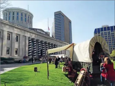  ?? ASSOCIATED PRESS FILE ?? Visitors explore a Civil War-era encampment and demonstrat­ions staged on the lawn of the Ohio Statehouse on April 29, 2015, in Columbus.