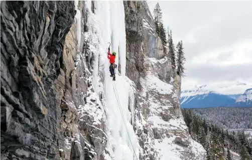  ??  ?? Opposite: Marko Delesalle leading the first pitch of Sacre Bleu, WI5 in Banff National Park, Alta. Above: Lindsay leading Carlsberg Column in Field, B.C.