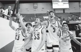  ?? AL DIAZ adiaz@miamiheral­d.com ?? Riviera Prep’s Fernando Romero (23), Dante Allen (35), Cooper Josefsberg (3) and Emi Moreno celebrate after defeating Windermere Prep 51-27 in the Class 3A state final.