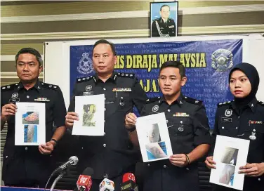  ??  ?? Photograph­ic evidence: (From left) Supt Mohd Sabri Abdullah, ACP Ahmad Dzaffir, DSP Rodney Pasla Harris and ASP Farizatuak­ma Sabtu showing pictures of the abused teen.
