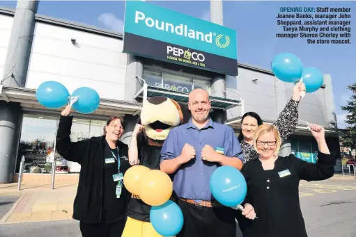 ??  ?? OPENING DAY: Staff member Joanne Banks, manager John Sheppard, assistant manager Tanya Murphy and clothing manager Sharon Chorley with the store mascot.