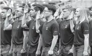  ?? Gregory Bull / Associated Press file ?? Recruits take their oath at a San Diego ceremony in 2017. The Army missed its recruiting goal last year, but it likely will meet a lower target this year.