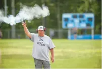  ?? ?? Mark Dunn fires the starting gun during a recent practice.