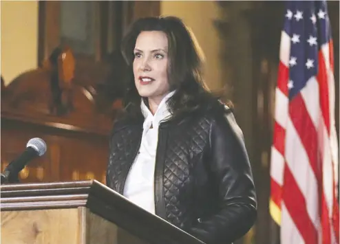  ?? Michigan Governor’s office/ Handout via REUTERS ?? Michigan Gov. Gretchen Whitmer speaks during a news conference Thursday after 13 people were arrested
for allegedly plotting to take Whitmer hostage and attack the state capitol building in Lansing.