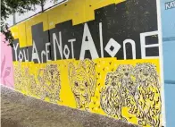  ?? ?? Artist Lea Craigie-marshall created a mural featuring a mental health message for the Noma in Color arts celebratio­n in Washington in September 2023. (Donna St. George/ The Washington Post)