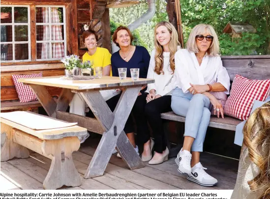  ?? ?? Alpine hospitalit­y: Carrie Johnson with Amelie Derbaudren­ghien (partner of Belgian EU leader Charles Michel) Britta Ernst (wife of German Chancellor Olaf Scholz) and Brigitte Macron in Elmau, Bavaria, yesterday