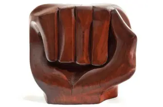  ?? Photograph­y by Edward C. Robison III/ Crystal Bridges Museum ?? “Black Unity,” 1968, by Elizabeth Catlett, is cedar, 21 inches by 12.5 inches by 23 inches. It is part of the “Soul of a Nation: Art in the Age of Black Power” exhibit opening Feb. 3 at Crystal Bridges Museum of American Art.