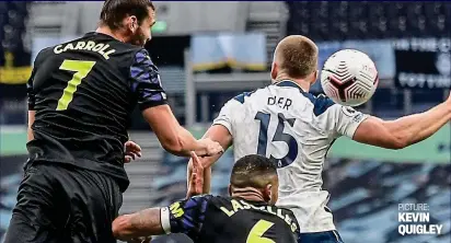  ?? PICTURE: KEVIN QUIGLEY ?? Dire decision: Eric Dier is not even facing the ball as it hits his arm as he jumps with Andy Carroll