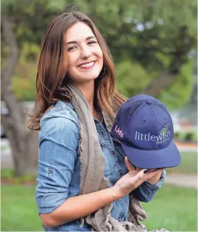  ?? MATT KRYGERM, THE INDIANAPOL­IS STAR ?? Liz Niemiec, a senior at Butler, runs her own non-profit, Little Wish, which grants small wishes to kids with cancer.