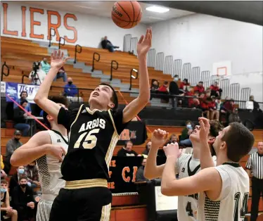  ?? PILOT PHOTO/MAGGIE NIXON ?? Caden Nifong goes up for a rebound in Argos’ first round win in the Culver Sectional.