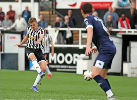  ?? PICTURES: Simon Howe ?? Dan Hayfield takes on a shot during Bath City’s narrow defeat to Dover Athletic