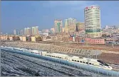  ?? VCG VIA GETTY IMAGES ?? A highspeed train runs across Urumqi, Xinjiang province, during a test run.