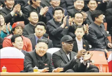  ?? Jason Mojica Associated Press ?? NORTH KOREAN leader Kim Jong Un and former NBA star Dennis Rodman watch members of the Harlem Globetrott­ers and North Koreans play basketball at an arena in Pyongyang, North Korea’s capital, in 2013.