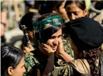  ?? AFP ?? Female fighters of the Syrian Democratic Forces gather during a celebratio­n at Al Naim square in Raqqa. —