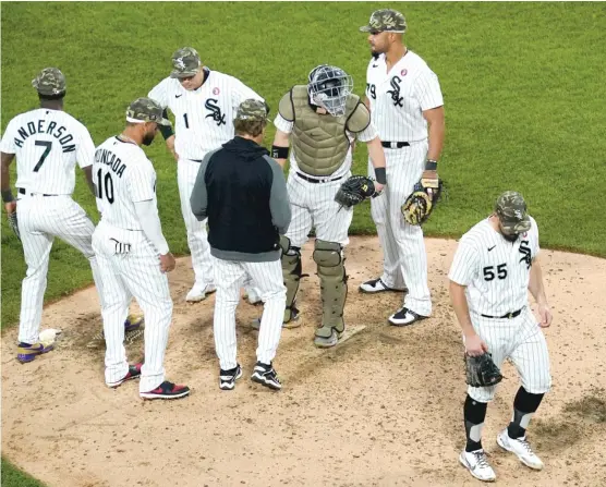  ?? NAM Y. HUH/AP ?? White Sox left-hander Carlos Rodon (55) heads to the dugout after turning the ball over to manager Tony La Russa in the sixth inning Saturday night.