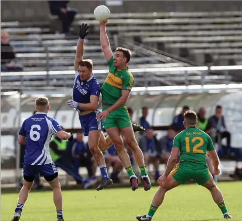  ??  ?? St Patrick’s captain Dean Healy rises with Rhode’s Alan McNamee during the Leinster club clash in Aughrim. Photo: Joe Byrne