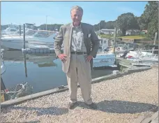  ?? LEE HOWARD THE DAY ?? Former New York Yankee John Ellis, seen at Three Belles Marina in Niantic, says he’s aiming at winning the fishing tournament Sept. 1516 that his nonprofit is sponsoring, though he’ll have to give back the money if he does.