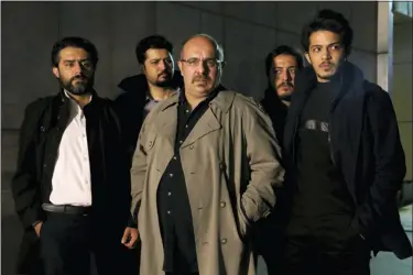  ?? MOHAMMAD BAGHERI — TV SERIES, “GANDO,” VIA AP ?? This undated promotiona­l handout still from the Iranian state TV series, “Gando,” shows actor Payam Dehkordi, center, who plays a character apparently based on Washington Post journalist Jason Rezaian, among other actors.